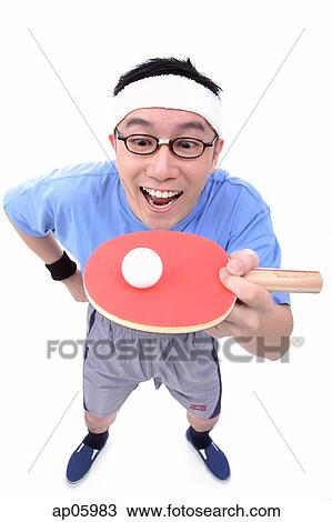 Stock Image - Man with ping pong racket, balancing ball. Fotosearch