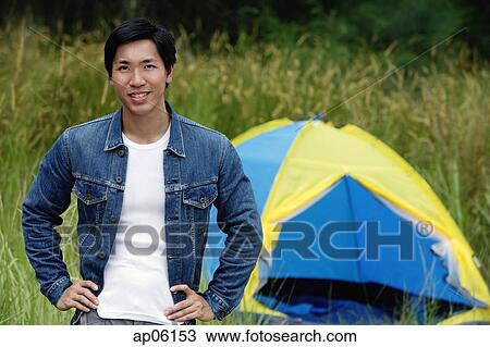 Man with tent in the background, portrait View Large Photo Image Stock Image - Man with tent in the background, portrait. Fotosearch