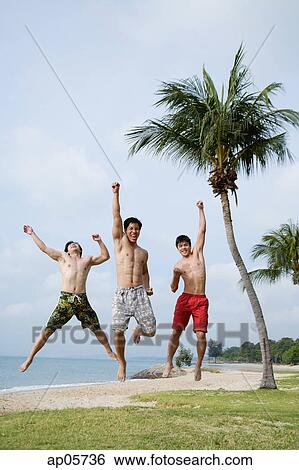 Men jumping in air, arms outstretched View Large Photo Image Stock Photograph - Men jumping in air, arms outstretched. Fotosearch