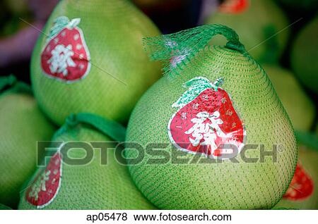 Stock Photo - Pomelos for sale, travel still life. Fotosearch