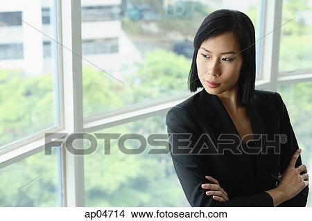 Portrait of businesswoman, arms crossed, looking away View Large Photo Image Picture - Portrait of businesswoman, arms crossed, looking away. Fotosearch