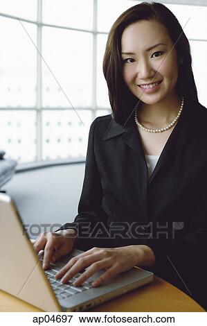 Portrait of businesswoman with laptop View Large Photo Image Stock Photo - Portrait of businesswoman with laptop. Fotosearch