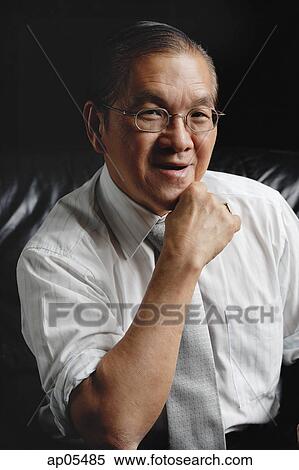 Senior man in tie, looking at camera, hand on chin View Large Photo Image Stock Photography - Senior man in tie, looking at camera, hand on chin. Fotosearch