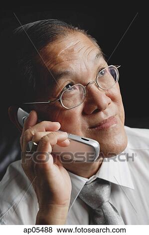 Senior man using mobile phone View Large Photo Image Stock Photo - Senior man using mobile phone. Fotosearch