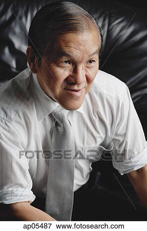 Senior man wearing tie, looking away View Large Photo Image Stock Photo - Senior man wearing tie, looking away. Fotosearch