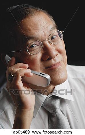 Stock Photo - Senior man with mobile phone. Fotosearch