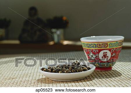 Stock Image - Still life with Chinese teacup and plate. Fotosearch