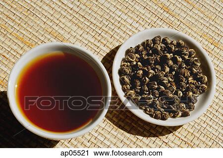 Still life with Teacup and plate of tea leaves View Large Photo Image Stock Image - Still life with Teacup and plate of tea leaves. Fotosearch