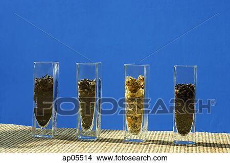 Tea leaves in glass containers, in a row View Large Photo Image Picture - Tea leaves in glass containers, in a row. Fotosearch