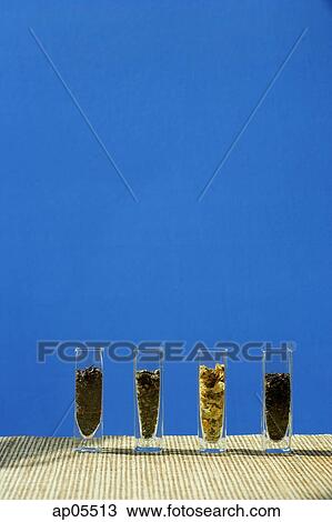 Stock Image - Tea leaves in glass containers. Fotosearch