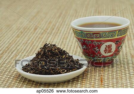 Tea leaves on plate and Chinese teacup, still life View Large Photo Image Stock Photograph - Tea leaves on plate and Chinese teacup, still life. Fotosearch