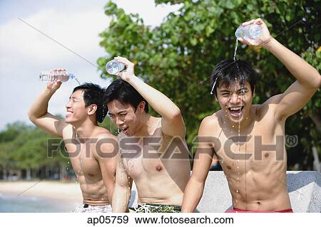 Three men sitting side by side, pouring water on themselves View Large Photo Image Stock Photo - Three men sitting side by side, pouring water on themselves. Fotosearch