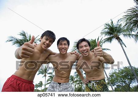 Three men with arms around each other, smiling at camera View Large Photo Image Stock Image - Three men with arms around each other, smiling at camera. Fotosearch