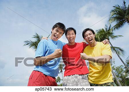 Three men with arms around each other, looking at camera View Large Photo Image Stock Image - Three men with arms around each other, looking at camera. Fotosearch