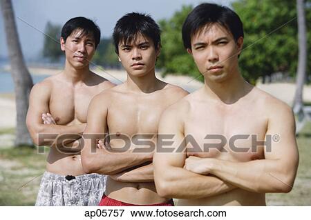 Stock Photo - Three men with arms crossed, frowning. Fotosearch