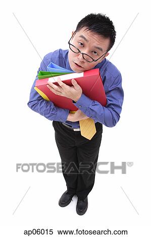 Tired Businessman carrying multi coloured folders View Large Photo Image Stock Photography - Tired Businessman carrying multi coloured folders. Fotosearch