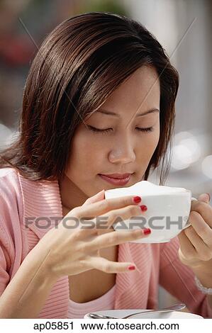 Woman drinking cappuccino View Large Photo Image Stock Image - Woman drinking cappuccino. Fotosearch
