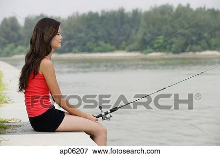 Woman fishing View Large Photo Image Stock Photo - Woman fishing. Fotosearch
