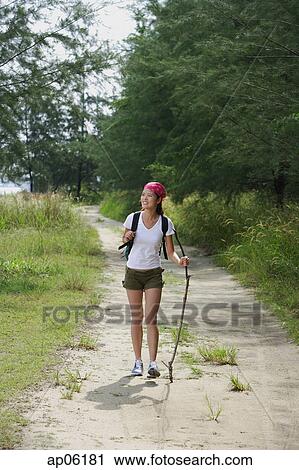 Stock Image - Woman hiking. Fotosearch