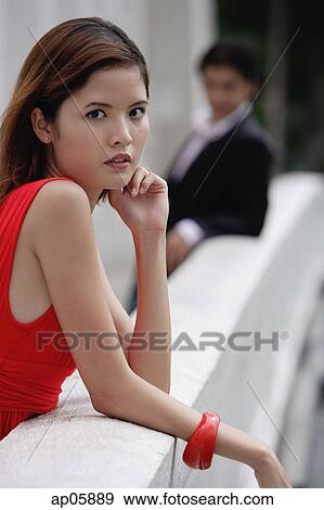 Woman leaning on bridge railing, looking at camera View Large Photo Image Stock Photo - Woman leaning on bridge railing, looking at camera. Fotosearch
