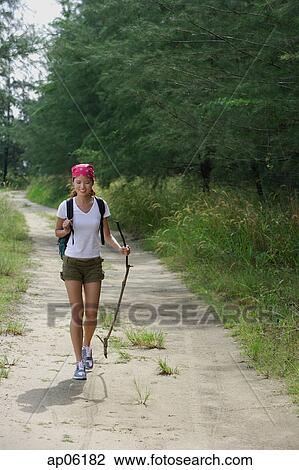 Woman on hiking trail View Large Photo Image Stock Image - Woman on hiking trail. Fotosearch
