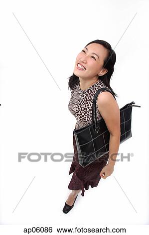 Woman with shoulder bag, looking up View Large Photo Image Stock Photograph - Woman with shoulder bag, looking up. Fotosearch