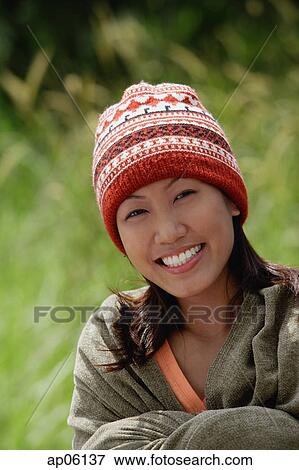 Woman with ski cap, wrapped in a blanket View Large Photo Image Stock Photo - Woman with ski cap, wrapped in a blanket. Fotosearch