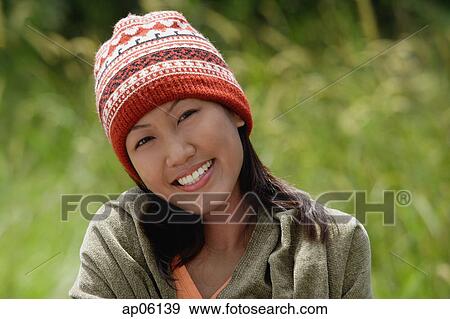 Woman with ski cap, wrapped in a blanket, portrait View Large Photo Image Stock Photo - Woman with ski cap, wrapped in a blanket, portrait. Fotosearch