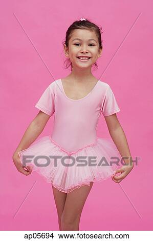 Picture - Young girl in ballerina costume, smiling at camera. Fotosearch