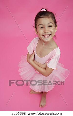 Young girl in ballet outfit, arms crossed, smiling View Large Photo Image Stock Photo - Young girl in ballet outfit, arms crossed, smiling. Fotosearch