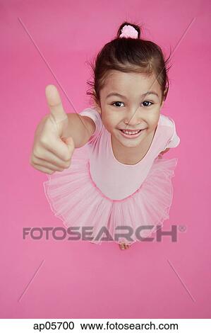 Young girl in ballet outfit, giving thumbs up sign View Large Photo Image Stock Image - Young girl in ballet outfit, giving thumbs up sign. Fotosearch