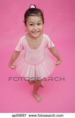 Young girl in ballet outfit, smiling at camera View Large Photo Image Stock Photo - Young girl in ballet outfit, smiling at camera. Fotosearch