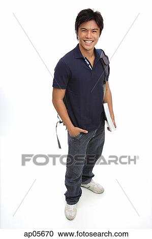 Young man carrying books and a backpack, portrait View Large Photo Image Stock Image - Young man carrying books and a backpack, portrait. Fotosearch