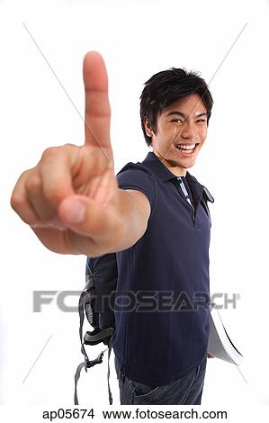 Picture - Young man making hand sign. Fotosearch