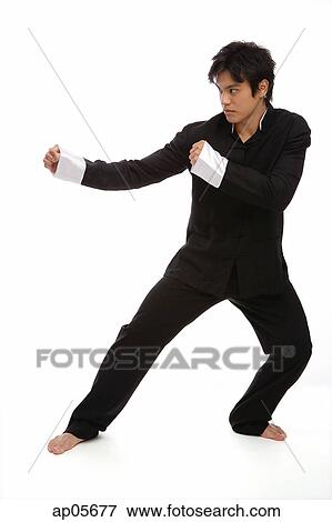 Young man practicing Kong fu View Large Photo Image Stock Photo - Young man practicing Kong fu. Fotosearch