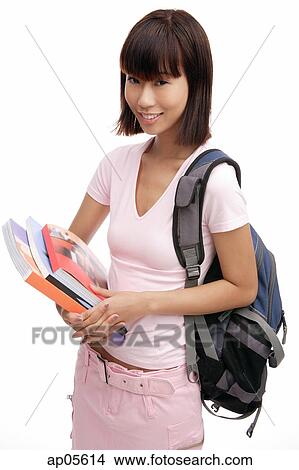 Young woman carrying backpack and books View Large Photo Image Picture - Young woman carrying backpack and books. Fotosearch