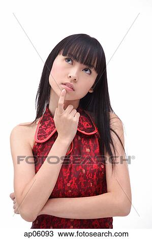 Young woman, finger on chin, looking up View Large Photo Image Stock Image - Young woman, finger on chin, looking up. Fotosearch