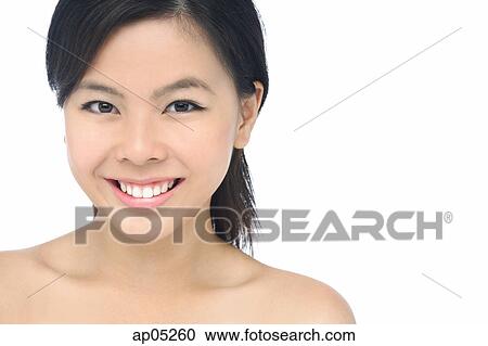 Young woman looking at camera, smiling View Large Photo Image Stock Image - Young woman looking at camera, smiling. Fotosearch
