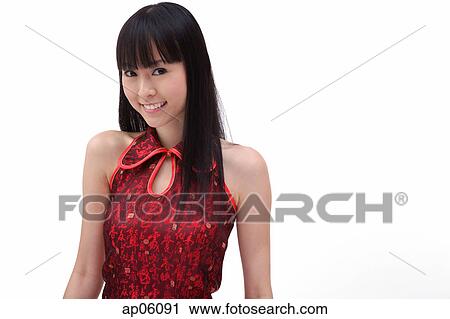 Young woman looking at camera, smiling View Large Photo Image Stock Image - Young woman looking at camera, smiling. Fotosearch