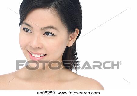 Young woman looking away, head shot View Large Photo Image Stock Photo - Young woman looking away, head shot. Fotosearch