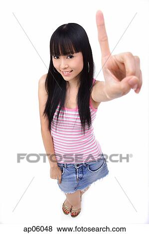 Stock Photo - Young woman making hand sign. Fotosearch