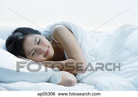 Young woman sleeping View Large Photo Image Stock Photograph - Young woman sleeping. Fotosearch