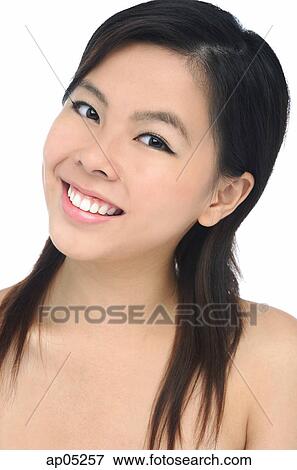 Stock Photo - Young woman smiling, head shot. Fotosearch