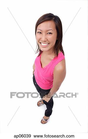 Young woman smiling up at camera View Large Photo Image Stock Photo - Young woman smiling up at camera. Fotosearch