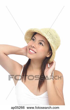 Young woman wearing hat, looking away, smiling View Large Photo Image Stock Photograph - Young woman wearing hat, looking away, smiling. Fotosearch