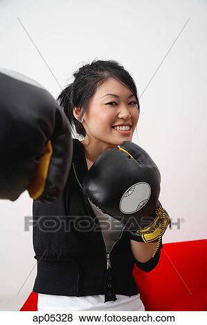 Young woman with boxing gloves View Large Photo Image Stock Photo - Young woman with boxing gloves. Fotosearch