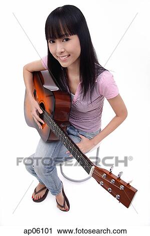 Young woman with guitar, portrait View Large Photo Image Stock Image - Young woman with guitar, portrait. Fotosearch