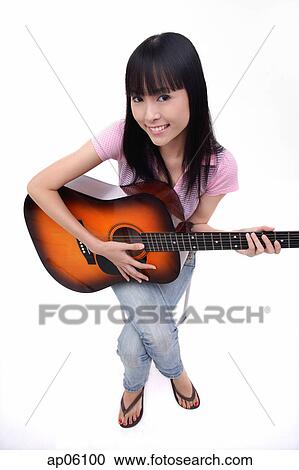 Young woman with guitar, smiling at camera View Large Photo Image Stock Image - Young woman with guitar, smiling at camera. Fotosearch