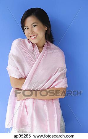 Young woman with scarf, smiling View Large Photo Image Stock Photography - Young woman with scarf, smiling. Fotosearch