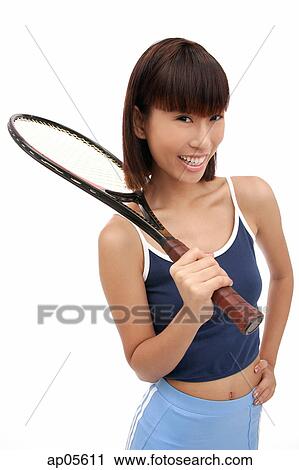 Young woman with tennis racket, smiling at camera View Large Photo Image Stock Image - Young woman with tennis racket, smiling at camera. Fotosearch
